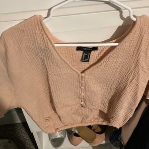 light pink forever 21 shirt with broken button on the bottom